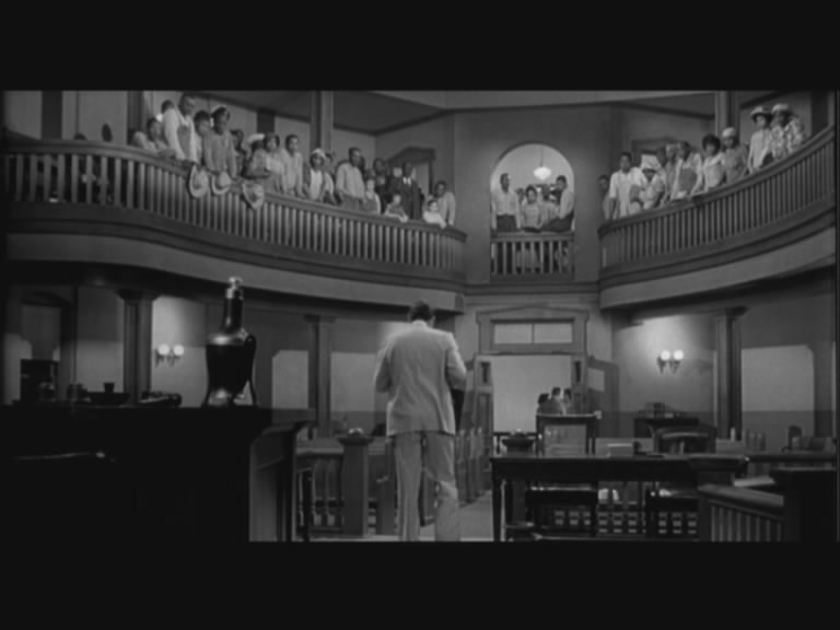 Atticus leaves the courtroom after the trial....