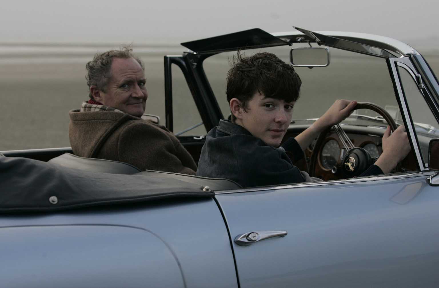 Arthur and Blake drive a car on the beach. Yes, it's quite safe, I assure you.