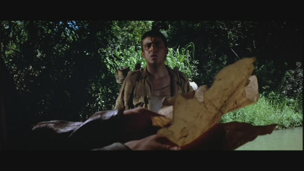 Alfred Molina watches Indy read a map.