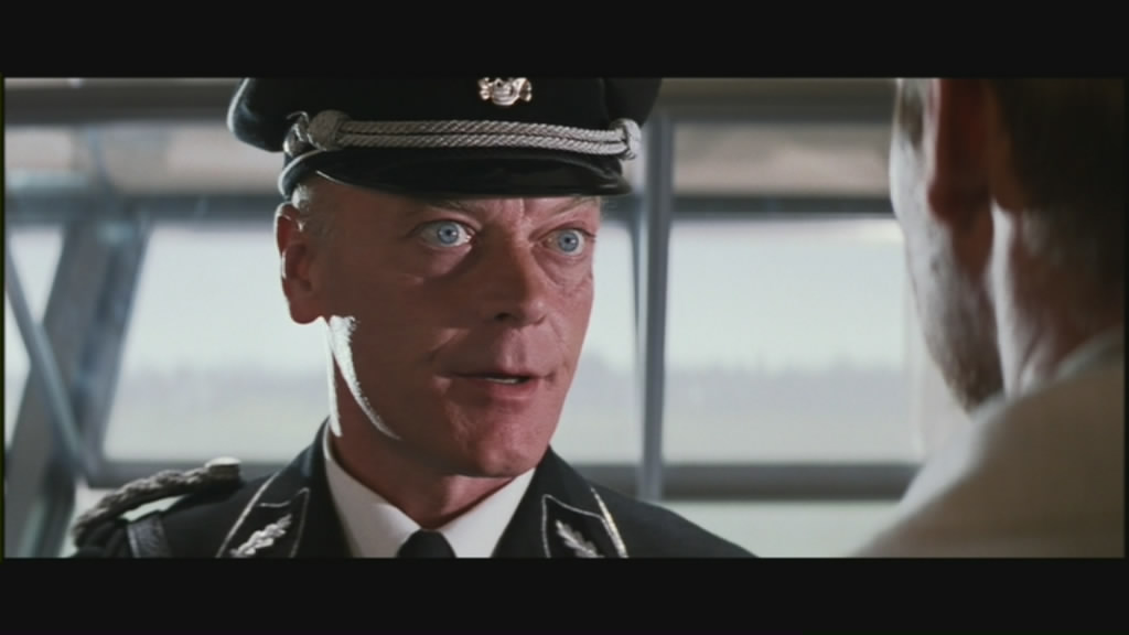 Michael Byrne as Vogel, a Nazi stooge.