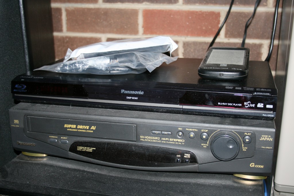 The Panasonic BluRay player takes pride of place on top of the home cinema pile....