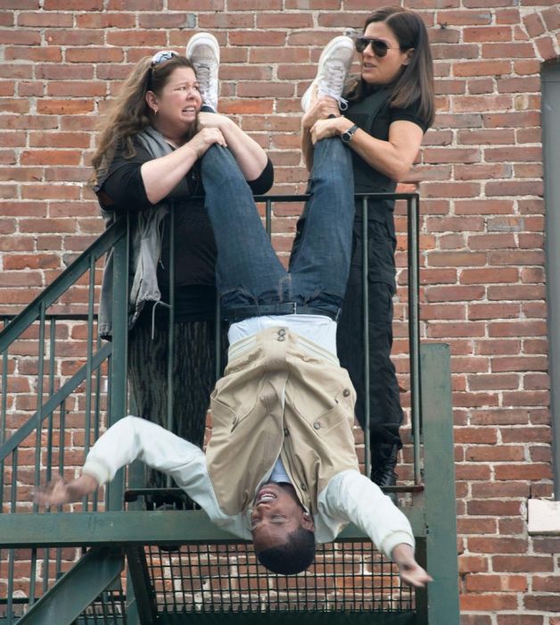 Two white women hanging a black man over a balcony? Racist? Not us!!