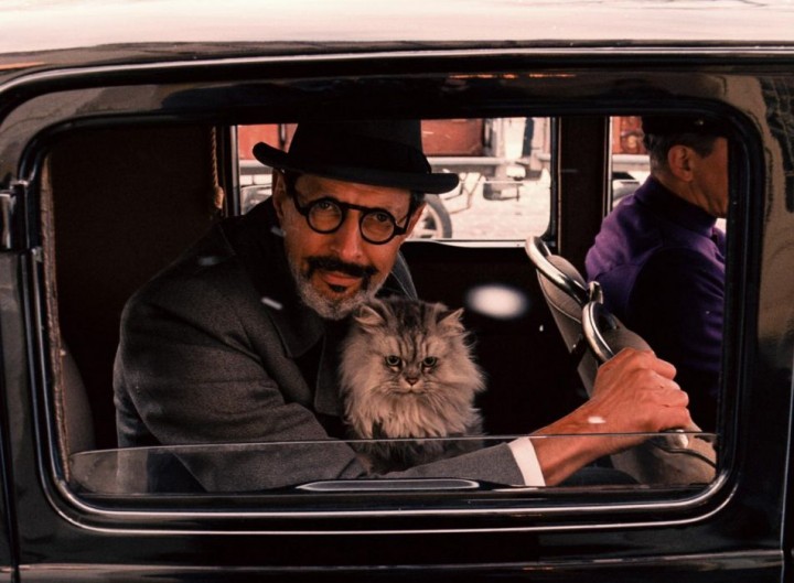 A man with a pussy in his lap.