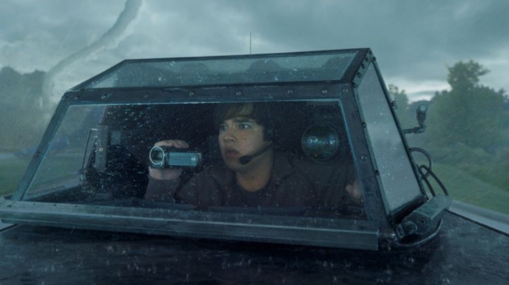 There's a massive IMAX camera lens over my left shoulder, but I'm more concerned with my handycam? How stupid IS this movie?