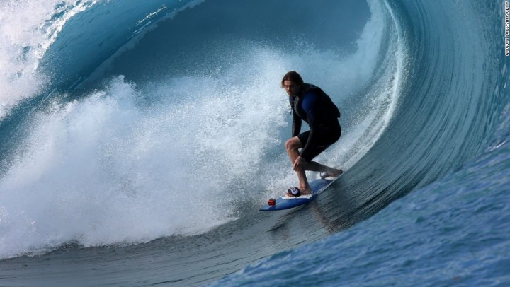 A surfer rides a wave during the shooting of a remake of the 1991 classic "Point Break" on September 11, 2014 in the Hava'e pass in Teahupoo, on the French Polynesian island of Tahiti. The American action thriller film directed by Ericson Core, starring Edgar Ramirez, Luke Bracey, Teresa Palmer and Ray Winstone, is a remake of the 1991 film then directed by Kathryn Bigelow.   AFP PHOTO / GREGORY BOISSY