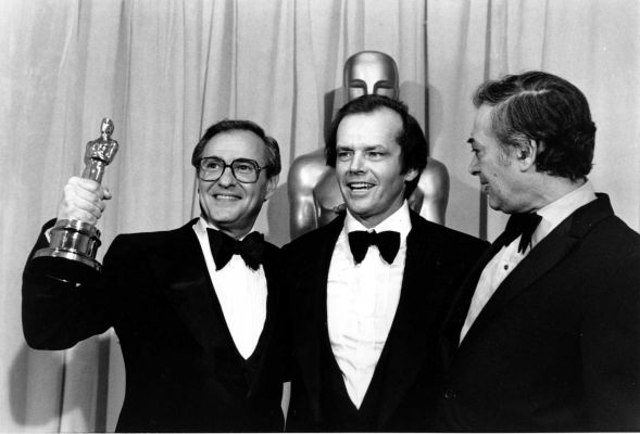 Jack Rollins (R) collecting the Oscar for Best Film for Annie Hall, with star Jack Nicholson (C) and co-producer Charles Joffe (R), in 1978.