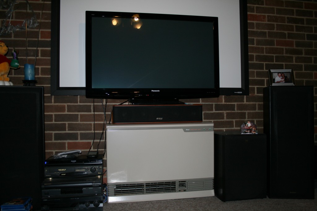 The new screen sits in front of the old projector screen... Note size difference (but not picture quality)...