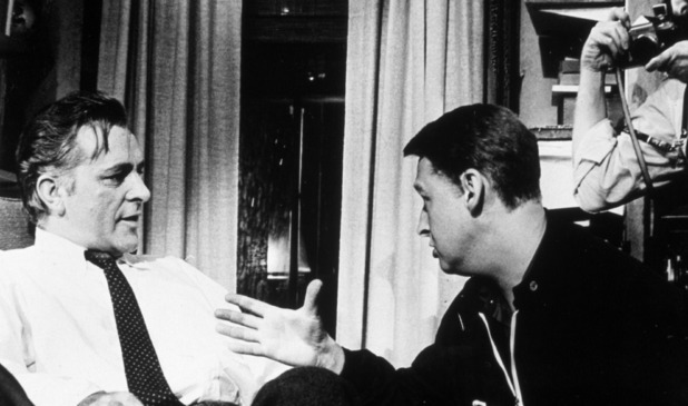 Richard Burton (L) discusses a scene with director Mike Nichols (R) on the set of Who's Afraid of Virginia Woolf?, circa 1966.