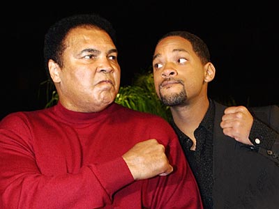Muhammad Ali posing with Will Smith, who portrayed the boxer in the 2001 film Ali.